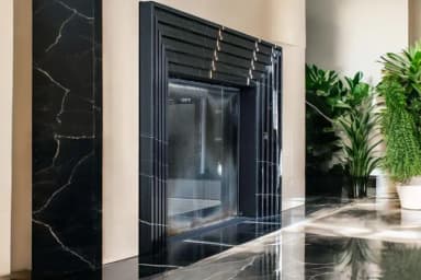 Hand-Carved Nero Marquina Marble Fireplace Mantel: Custom Luxury Design
